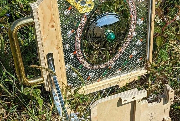 Image credit: David Lunney, Gorse Collector, 2024 Mixed media - Reflective and refractive materials, picture frame materials, fixings, smartphone. Dimensions variable